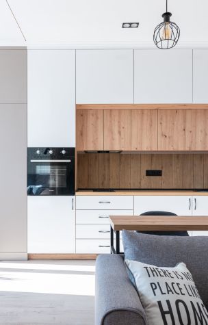 Room with open kitchen near sofa